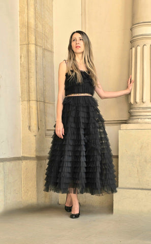 Tulle ruffles dress with handmade motifs.